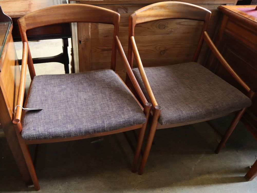 A set of four mid century Danish teak elbow chairs